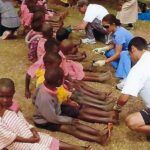 volunteers-treat-students